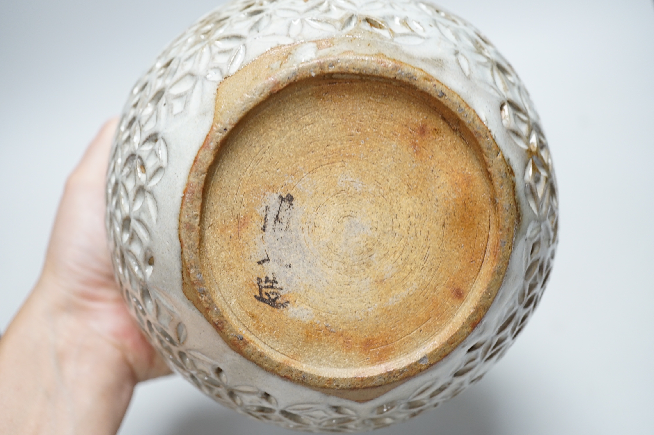 A reticulated art pottery vase and another pottery vase, largest 15cm high